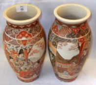 A pair of Satsuma Baluster Vases of tapering circular form, decorated with panels of figures,