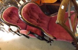 A Victorian Mahogany Framed Armchair, upholstered in pink fabric, raised on short front cabriole