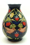 A Moorcroft Baluster Vase, decorated in colours with Lovebirds and Foliage on a green ground,