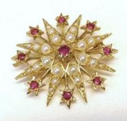 A hallmarked 9ct Gold Starburst design Brooch/Pendant, the points set with Seed Pearls