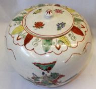 A late 19th Century Chinese large covered globular Jar, decorated in iron red and famille verte