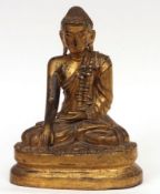 A Gilded Lacquered Burmese Buddha Statue modelled as a seated sakyamuni in bhurmisparsa mudra (