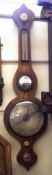A 19th Century Rosewood Wheel Barometer, with onion top, silvered hygrometer over single scale