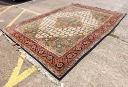 A 20th Century Kaimuri Wool Rug with multi-gull border, central lozenge mainly blue, red, green