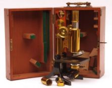 An early 20th Century black anodised and lacquered brass Microscope by J Swift & Son of London, in