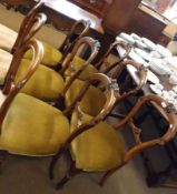 A set of six Victorian Mahogany Balloon Back Dining Chairs, the backs with carved floral roundels,