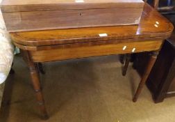 A mid-19th Century Mahogany Folding Card Table with inlaid banding, raised on four turned legs,