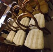 A set of six Victorian Mahogany Balloon Back Dining Chairs with striped upholstered seats, raised on