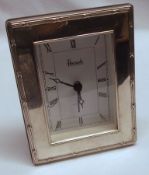 An Elizabeth II small Silver Fronted Dressing Table Clock by Harrods, London, 5” x 3 ½”