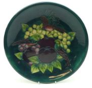 A Moorcroft Circular Plate, decorated with the “Finches” design on a green ground, circa late 20th