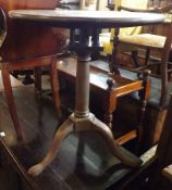 A Georgian Bleached Mahogany Pedestal Wine Table with bird cage support, turned pedestal raised on