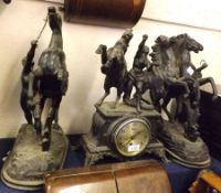 A composite Black Spelter Garniture, comprising a central Timepiece crested with rearing horses