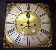 An Oak Longcase Clock, the square brass dial applied in the corners with figure spandrels and