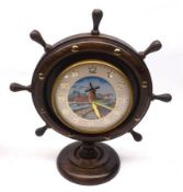 An Oak Cased Novelty Mantel Clock, formed as a ship’s wheel and the centre decorated with a canal