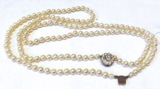 A Pearl type single strand Necklace with metal clasp