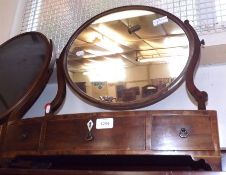 An early 19th Century Mahogany Bow Front Dressing Table Mirror with three drawers, raised on small