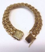 A heavy hallmarked 9ct Gold Woven Curb Link Bracelet, London 1976, weighing approximately 34 gm