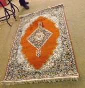 A 20th Century Kashmir Rug, wool/silk, triple gull border, central panel of lozenge, iron red, beige