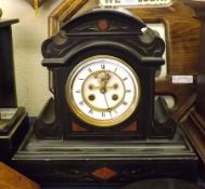 A Victorian Black Marble Mantel Clock, with domed top over a circular face with exposed