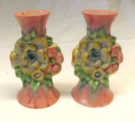 A pair of Clarice Cliff “My Garden” Candlesticks, the bodies relief moulded in the centre with