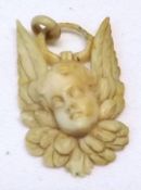 A small Victorian Carved Bone Angelic Head Pendant, 31mm drop