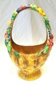 A Clarice Cliff “My Garden” Large Basket with coloured floral relief moulded handle over an ochre