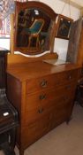 A late 19th Century Oak Dressing Chest, fitted with tilting mirror, two short and full length
