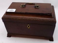A late 18th Century Mahogany Tea Caddy, the ogee top with central brass carry handle and void