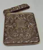 An Edwardian Card Case, rectangular shaped with hinged lid, all over embossed decoration of