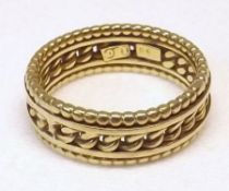 A high grade precious metal Rope Twist Design Ring, stamped “18C” and weighing approximately 5 ½ gm