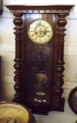 A late 19th Century Mahogany Cased Vienna style Wall Clock, glazed front door enclosing a circular