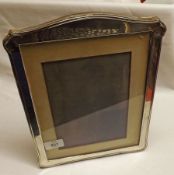 An early 20th Century Hallmarked Silver Mounted Photograph Frame of plain shaped rectangular form,
