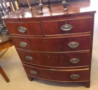 A 19th Century Mahogany Bow Front Chest of two short and three long drawers, with oval brass plate