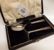 A George VI Cased Set of Child’s Spoon and Food Pusher, in Art Deco taste, Sheffield 1945, Makers