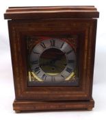 A Franz Hermie Mahogany Cased Mantel Clock, glazed door enclosing a silvered circular dial with