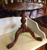 A 20th Century Small Wine Table with pie-crust edge, raised on a turned pedestal and three spreading