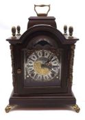 A Wuba Reproduction Mantel Clock, the arched top and brass carry handle encrusted with four
