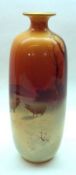 A Royal Doulton Narrow Neck Vase, decorated with a winter sunset scene with sheep, 10” high (
