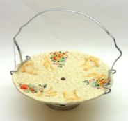 A Clarice Cliff Celtic Harvest Pedestal Cake Plate with chromium handle, decorated with fruit and