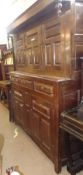 A large Oak Court Cupboard constructed of period timbers, the top with three panelled doors, the