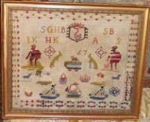 A Framed Woolwork Sampler, decorated with geometric border, various animal, boating and other motifs