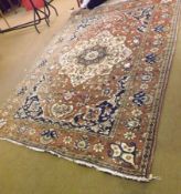 A late 20th Century Caucasian Carpet, central panel of floral lozenges, mainly puce field with