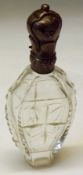 A 19th Century Continental Cut Glass Scent Bottle of flask form, with embossed hinged white metal
