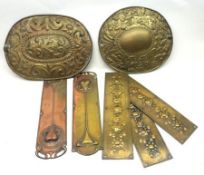 A Mixed Lot: five Brass and Copper Door Fingerplates and two Brass Wall Decorations