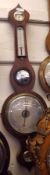 A 19th Century Rosewood Wheel Barometer, with onion top and silvered hygrometer over single scale