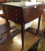 A first half of the 19th Century Mahogany Drop Leaf Sewing Table with two drawers and pleated bag