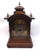 A 20th Century Mahogany Cased Mantel Clock with arched top and central platform, also crested with