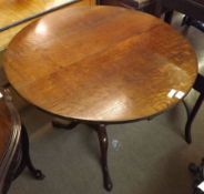 A 19th Century Round Topped Oak Table on tripod base, top 32” diameter