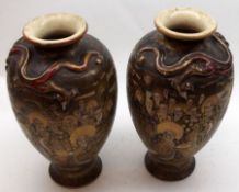 A pair of early 20th Century Satsuma Baluster Vases, the necks moulded with dragons and decorated