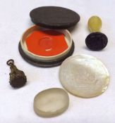 A small mixed lot of Chinese Engraved Mother-of-Pearl Gaming Counters; Cased Sample Intaglio Seal; a